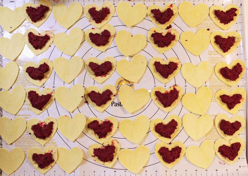  filling heart shaped ravioli with beet & goat cheese filling